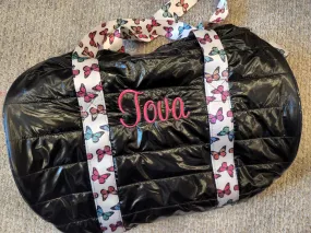 Black Puffer Duffel Bag With Butterfly Straps SOLD AS IS with the name "Tova" in hot pink